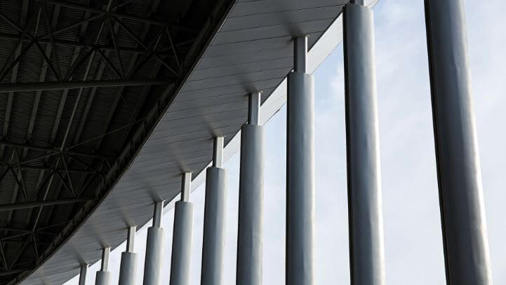 Gray concrete columns of building during daytime